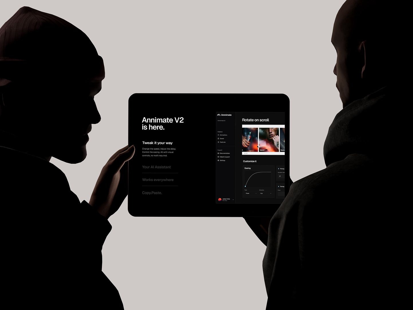 Two silhouetted people holding a tablet displaying the Annnimate interface with animation controls and UI previews
