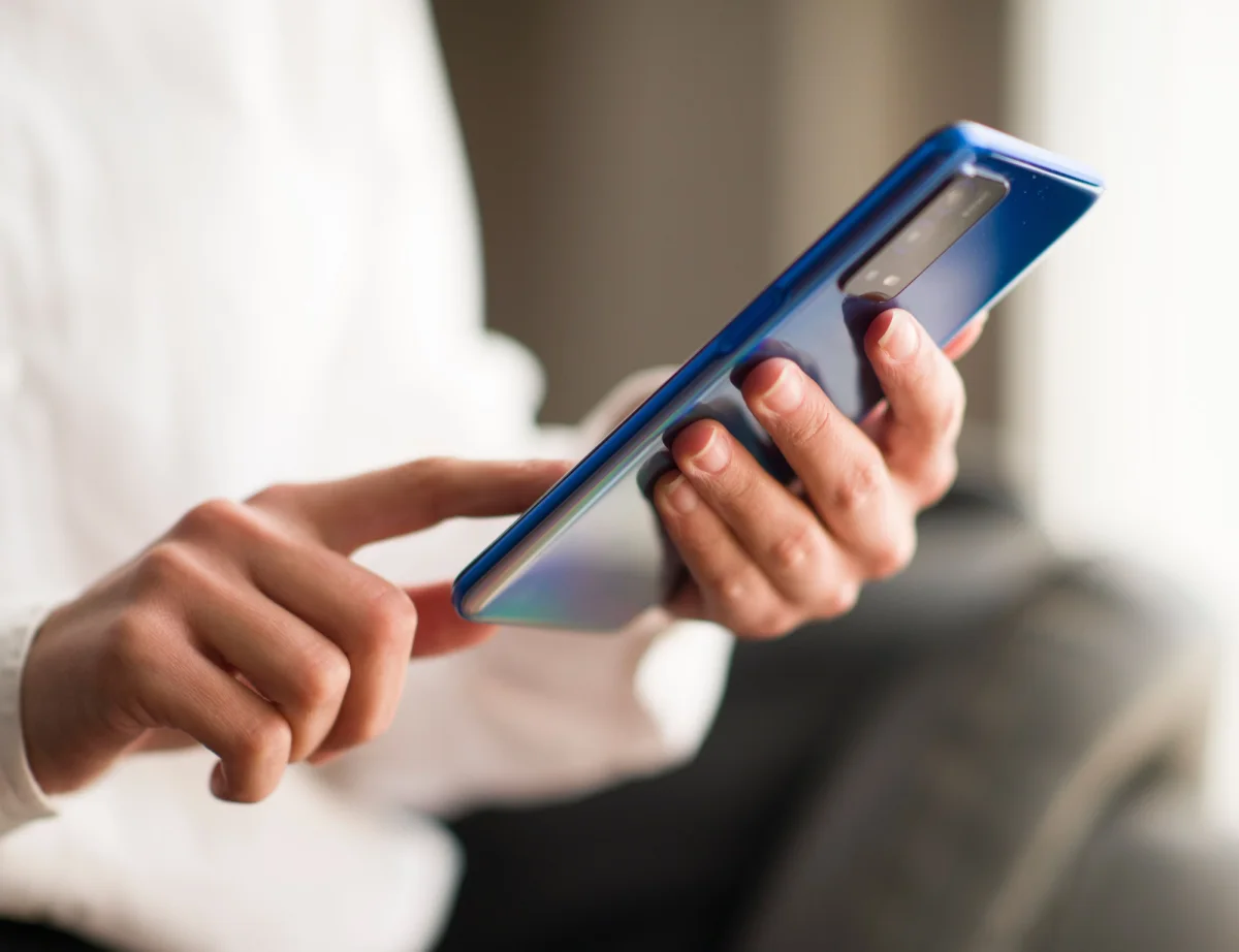 woman touching blue phone