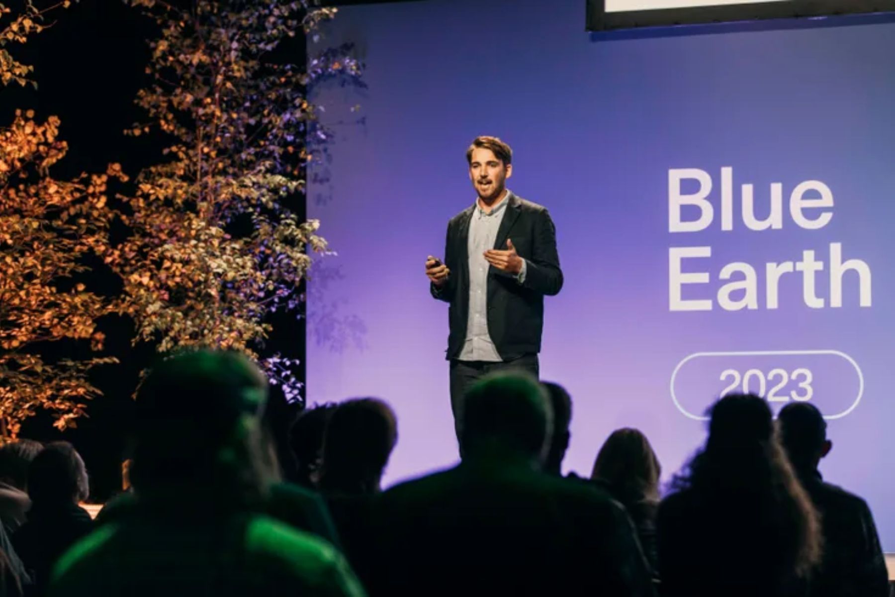 Guy Hayler, co-founder of Blue Earth Summit speaks on stage in 2023.