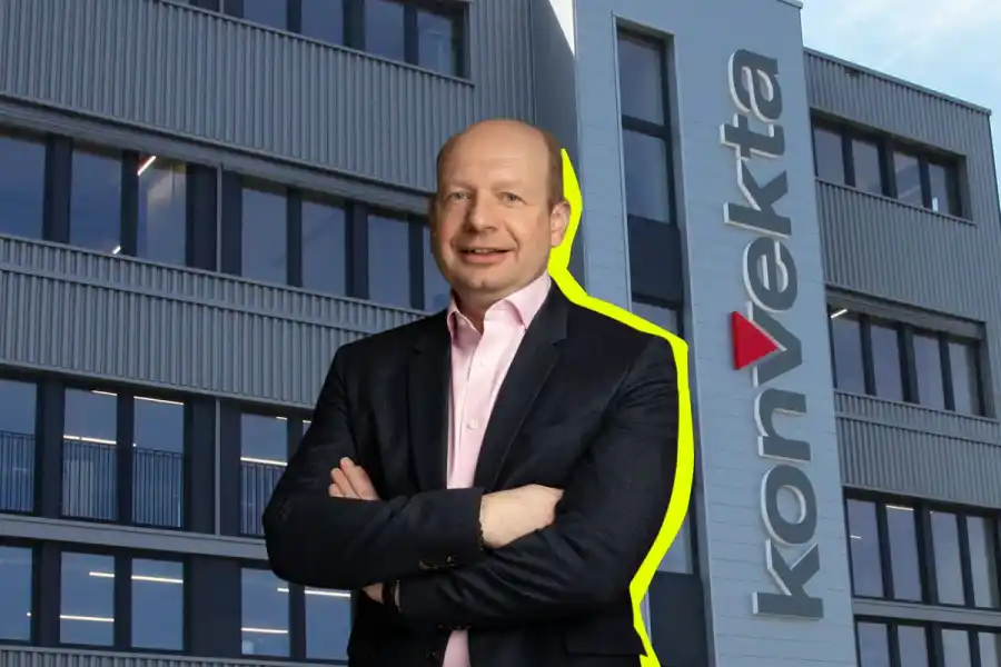 an collage image of Erich Becker, partner at Verdane, standing with arms folded, superimposed in front of the Konvekta office