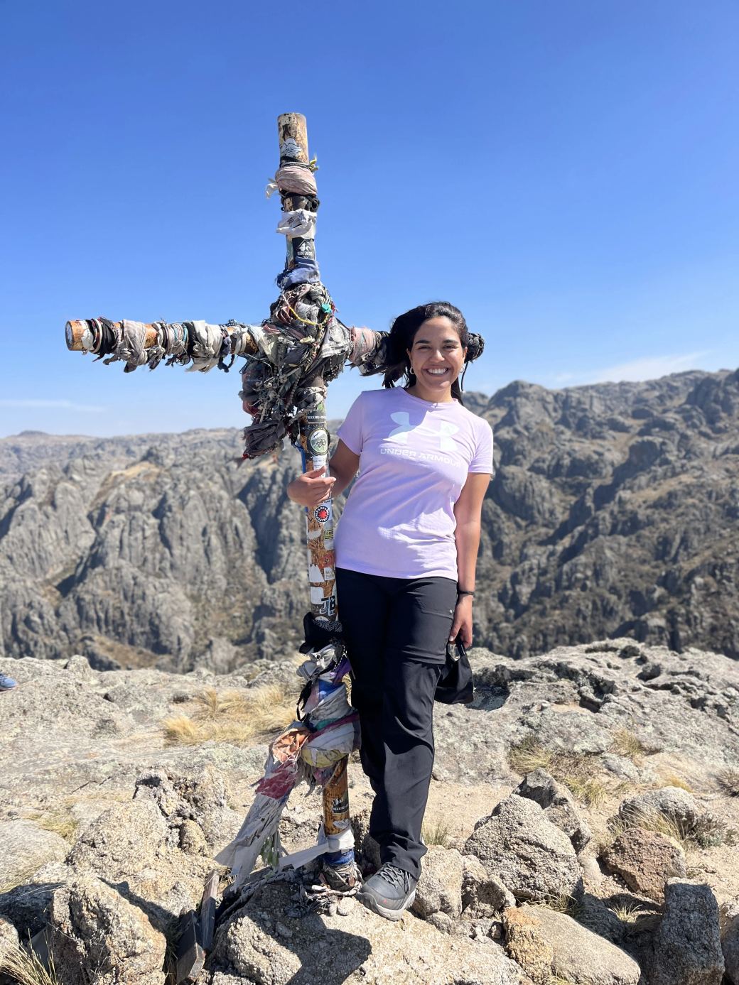A MONS trip participant at the summit cross of Los Gigantes, in the Sierras Grandes of Córdoba