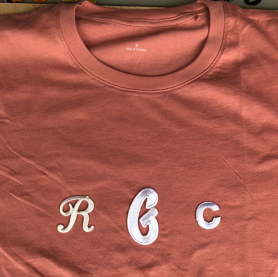 Coral t-shirt with embroidered white R G C letter patches