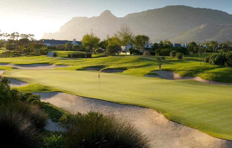 Steenberg golf course green with bunkers and the Cape Town mountains behind