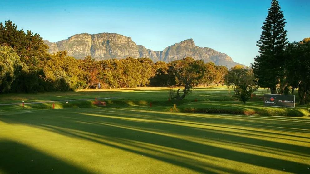 Royal Cape Golf Club fairway at golden hour with Table Mountain behind