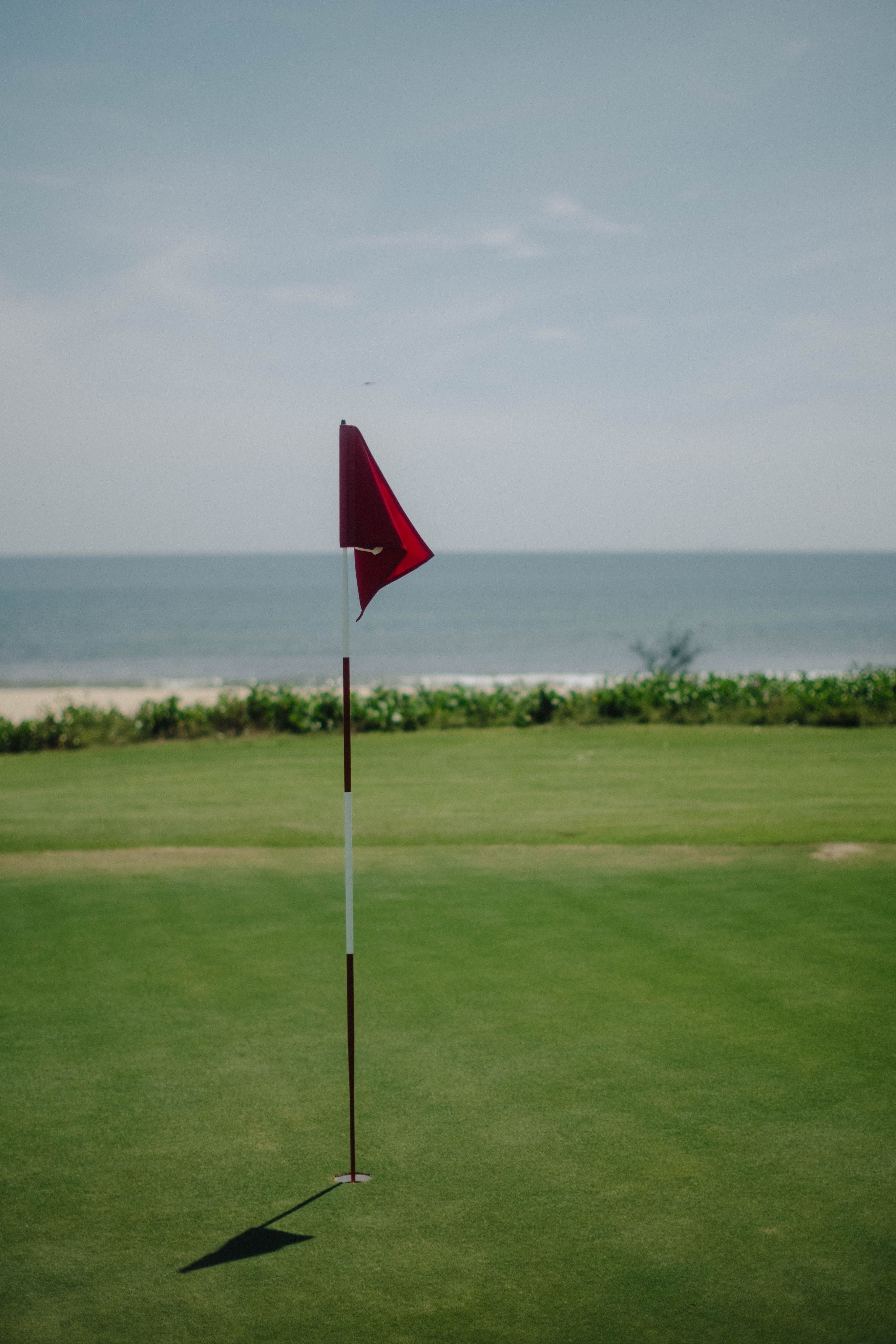 Red flag on a green overlooking the sea, Vietnam