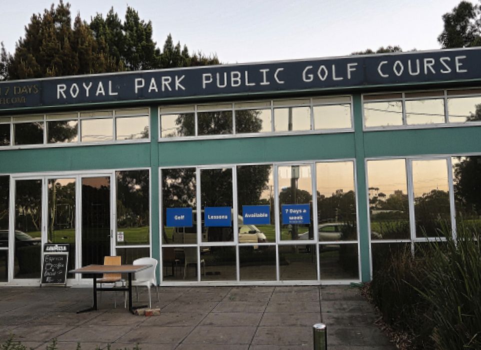 Storefront of Royal Park Public Golf Course with Golf, Lessons and 7 Days signs in the windows