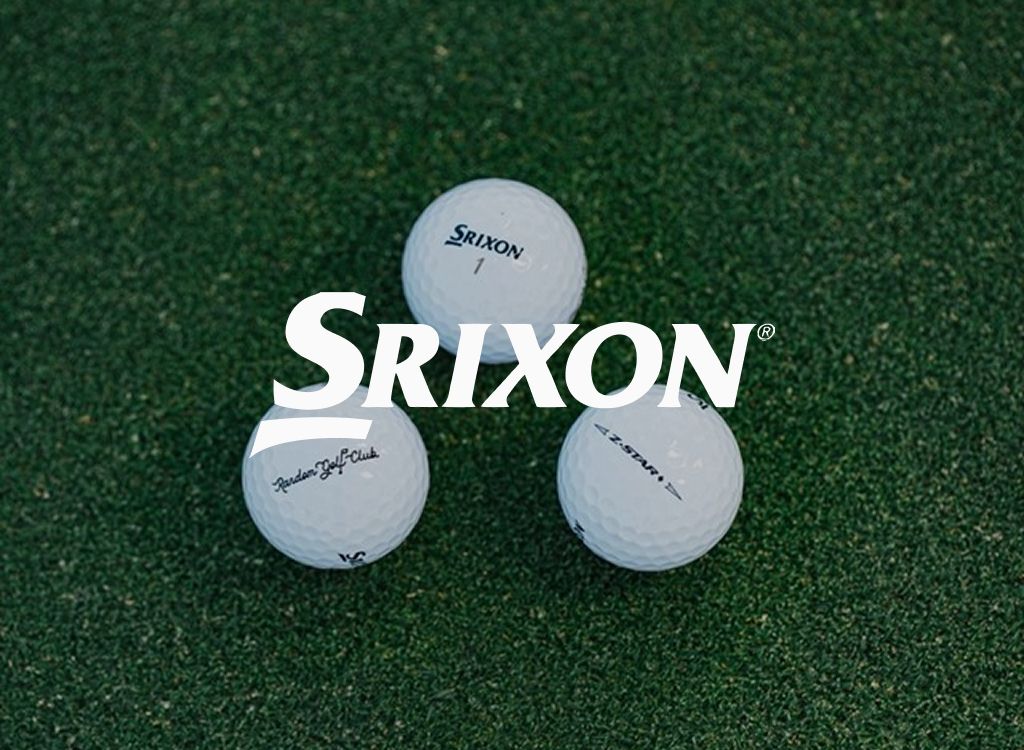 Srixon logo over three golf balls on artificial turf