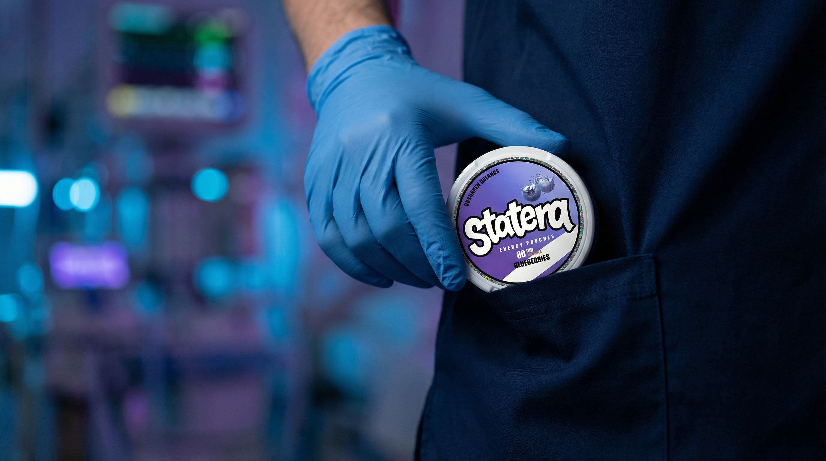 A healthcare worker taking a single white can of STATERA energy pouches while inside a blurred hospital ward at night