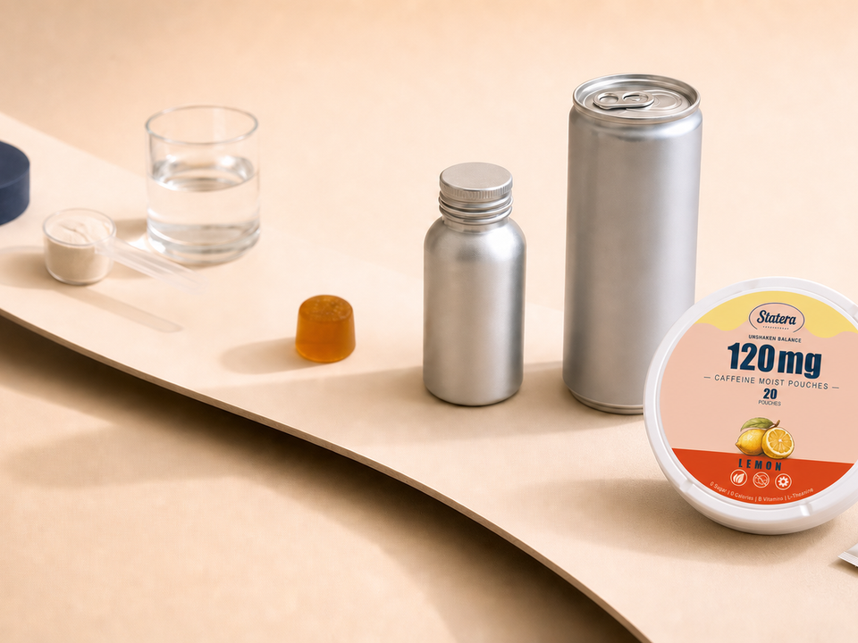 STATERA Lemon 120mg caffeine pouch can and loose oral pouch at the foreground of an editorial pathway featuring a capsule, powder, gummy, shot bottle and drink can