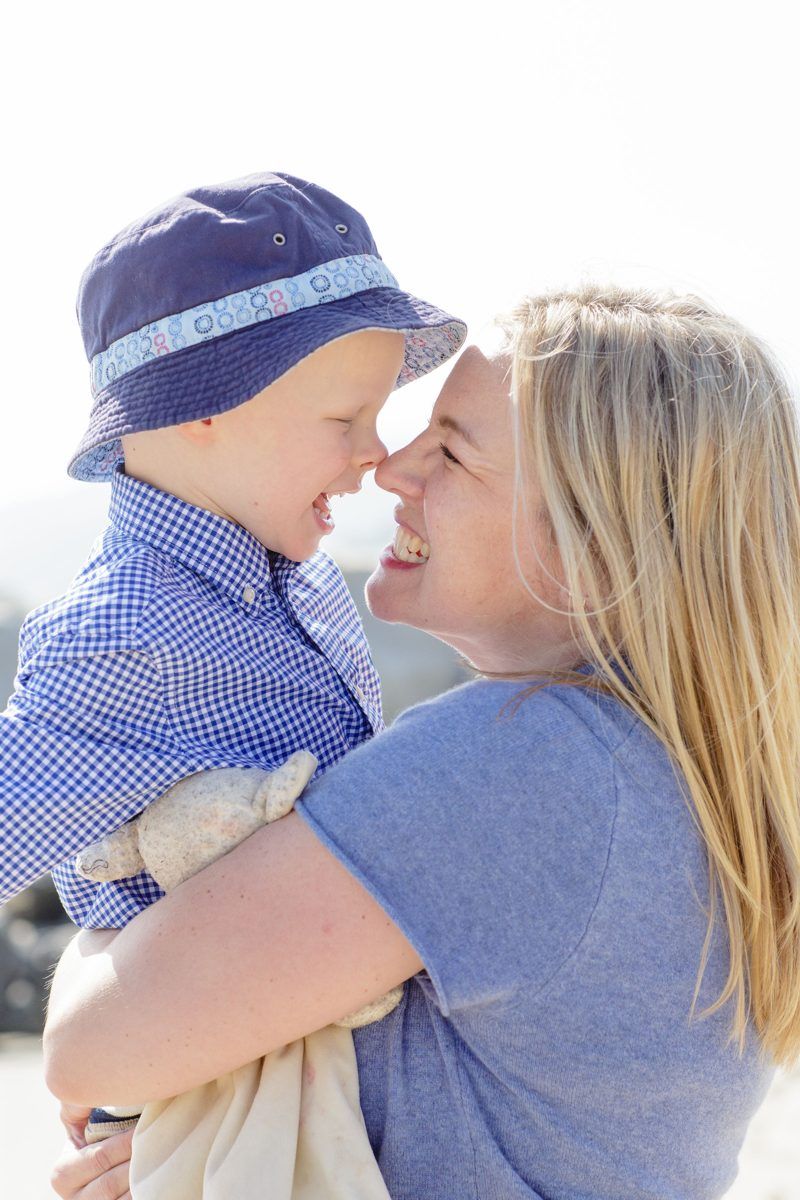 Courtney holding Alexander, both smiling