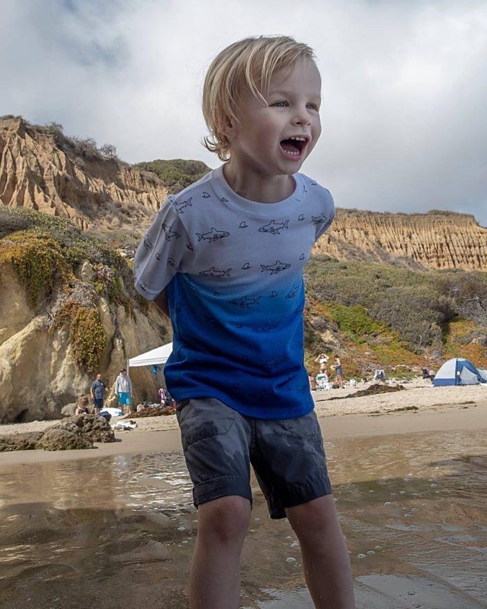 Alexander laughing at the beach
