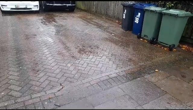 Rain running off a bricked over front garden