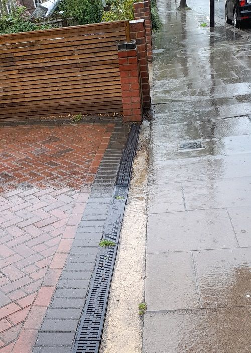 rain running off front garden despite drainage