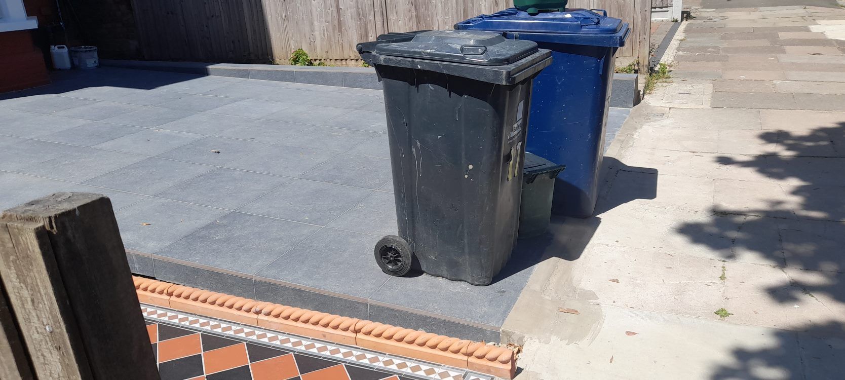 Paved over front gardens with bins