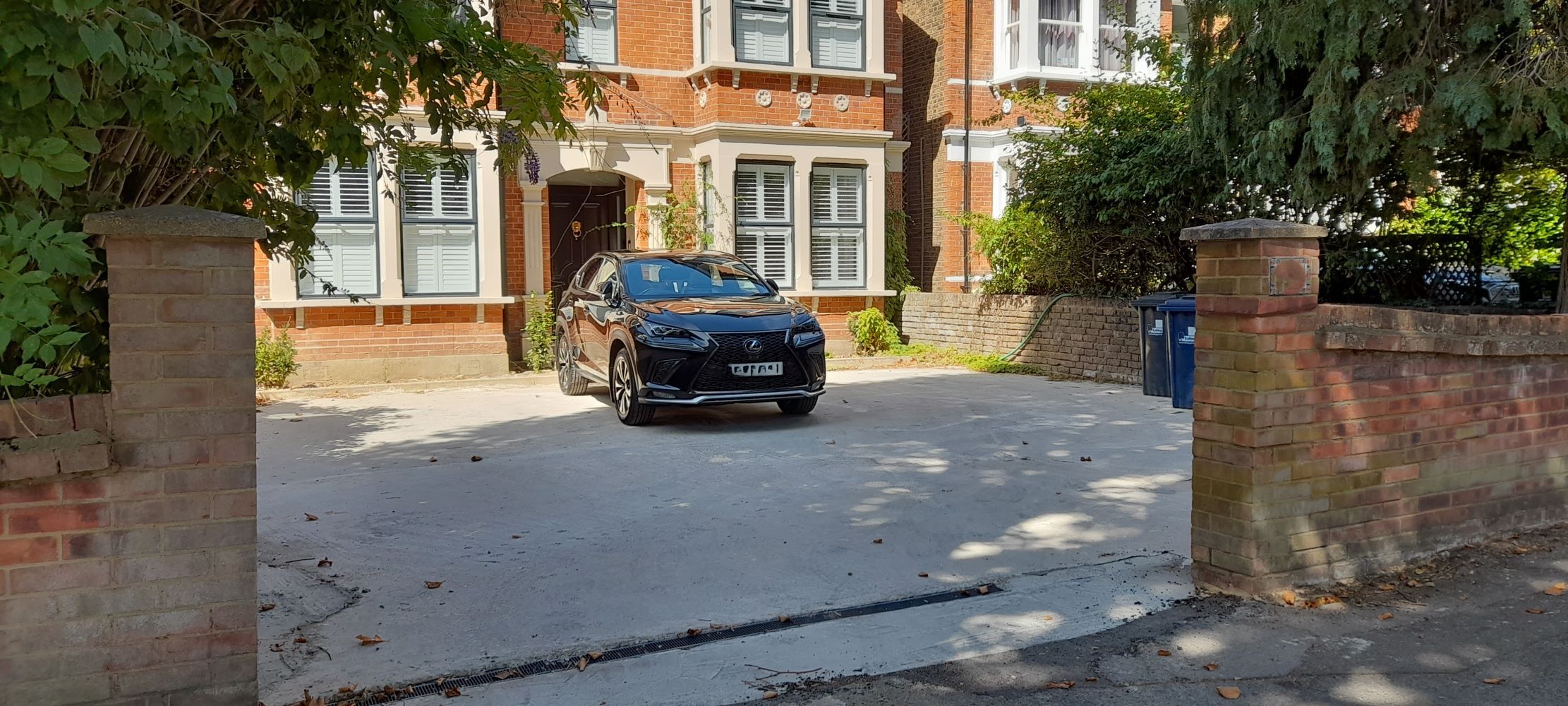 Large concreted front garden
