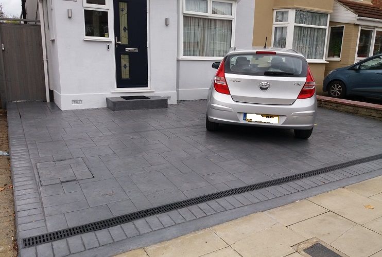 Photo of a recently-paved over front garden in Northolt, grey tiles, no plants at all