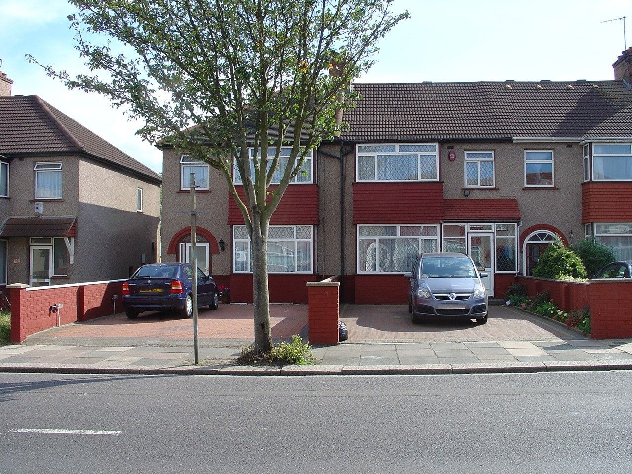 Two paved-over front gardens being used illegally for parking – neither has a crossover (photo: Christine Eborall)