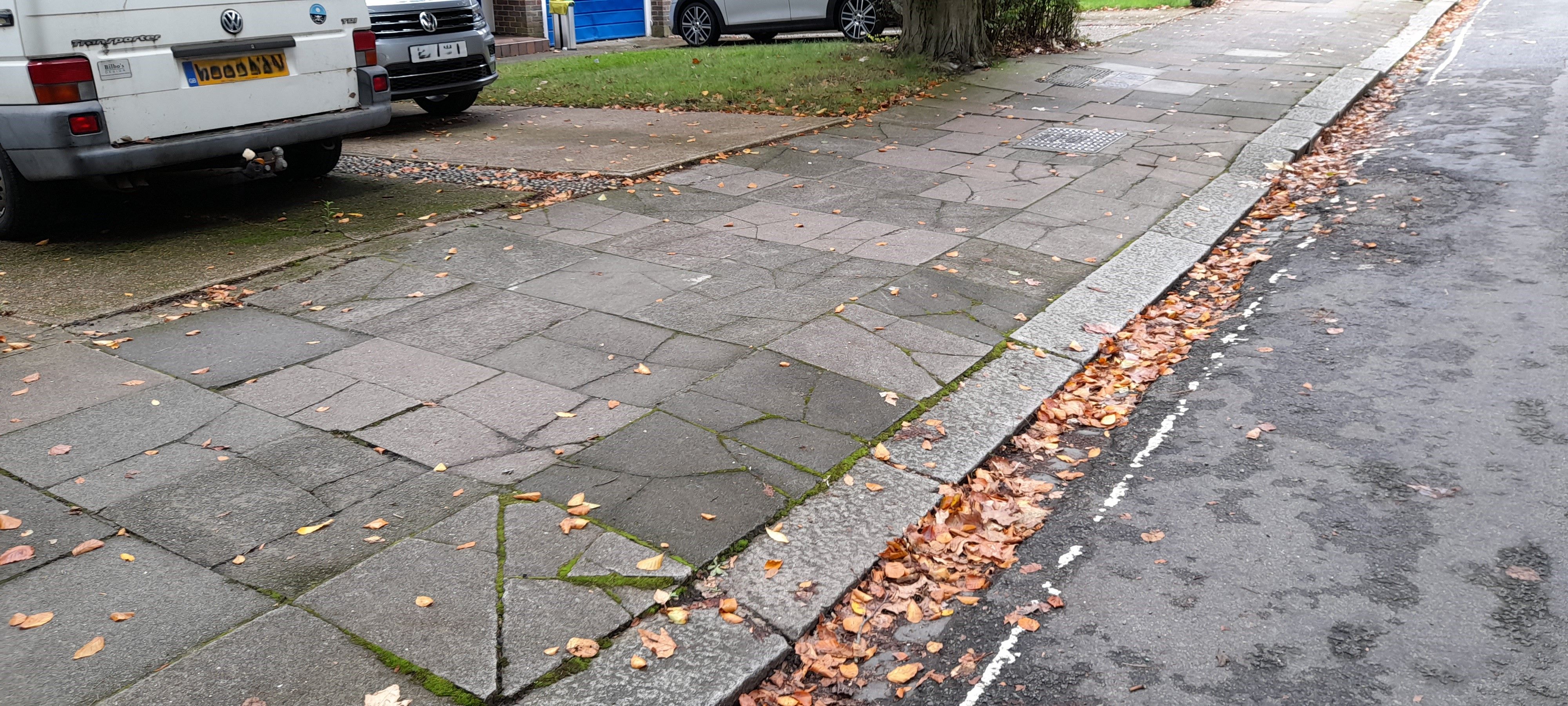 Pavement and crossover paving slabs damaged and uneven due to being driven over frequently; the pavement is also less safe for pedestrians as a result (photo: Christine Eborall)