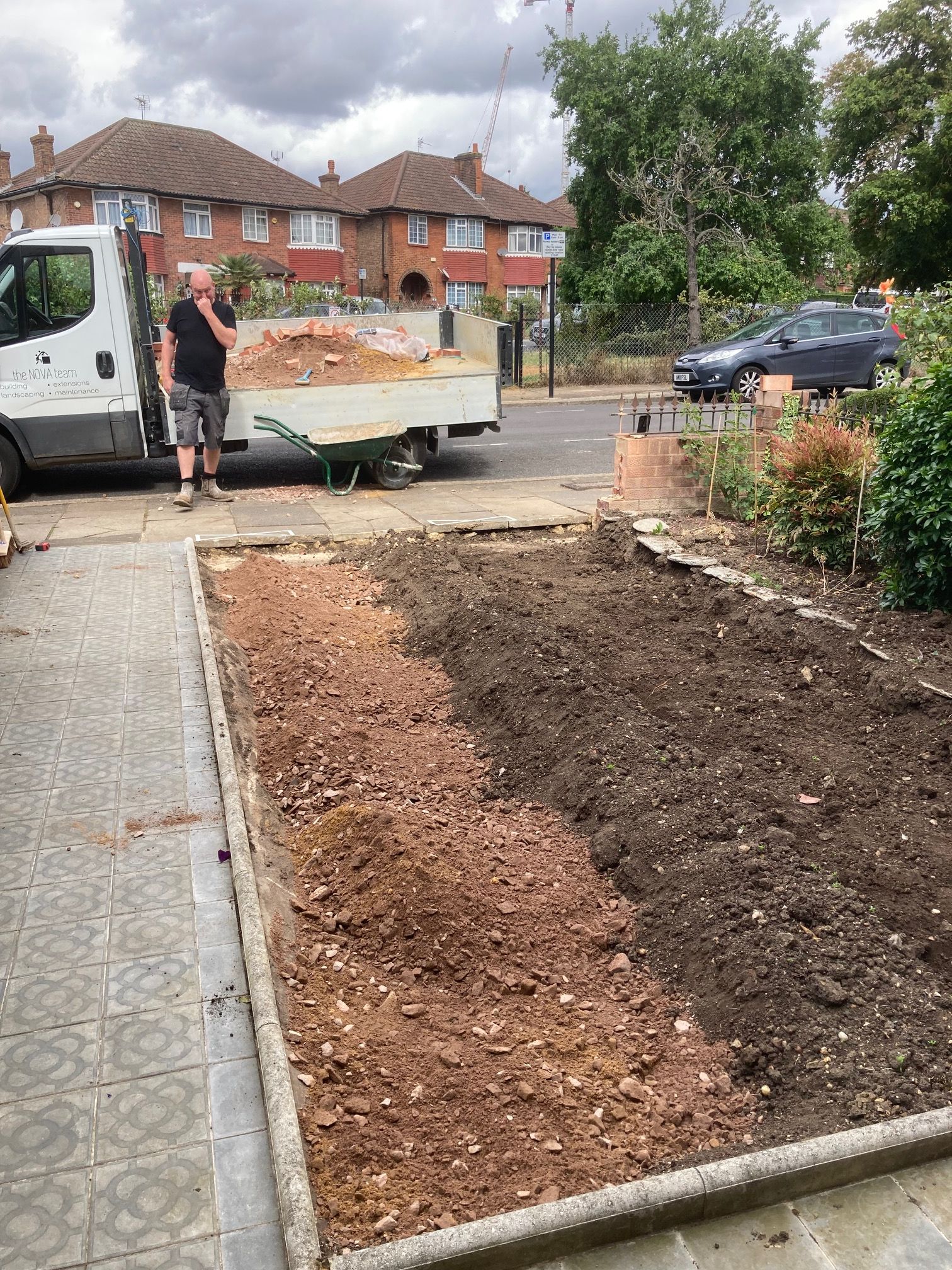 Front garden with plants dug out and parking surface being created