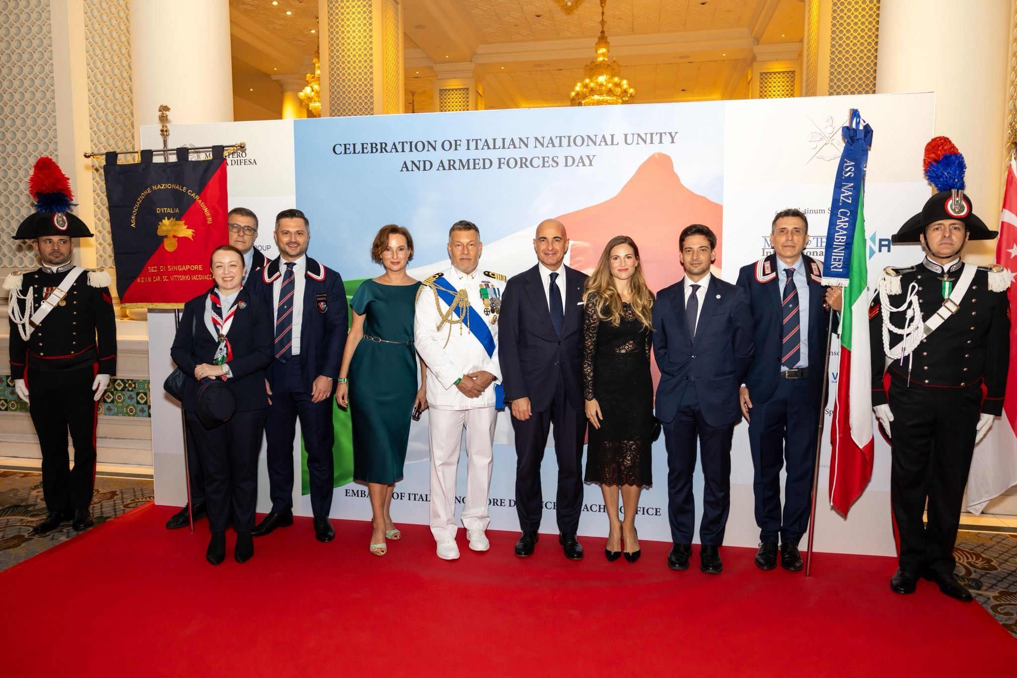Two Carabinieri in full gala uniform beside ANC Singapore members and guests at the celebration of Italian National Unity and Armed Forces Day.