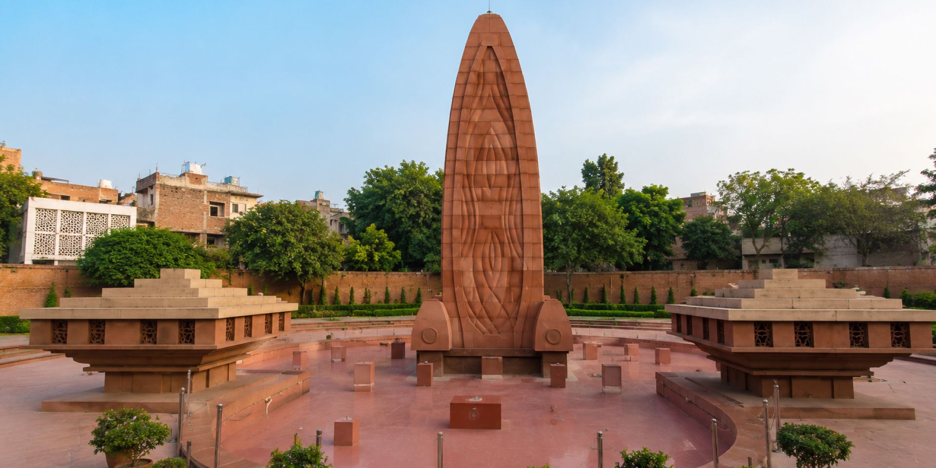 Pedestrian Heritage Street with uniform pink sandstone buildings leading to the Golden Temple