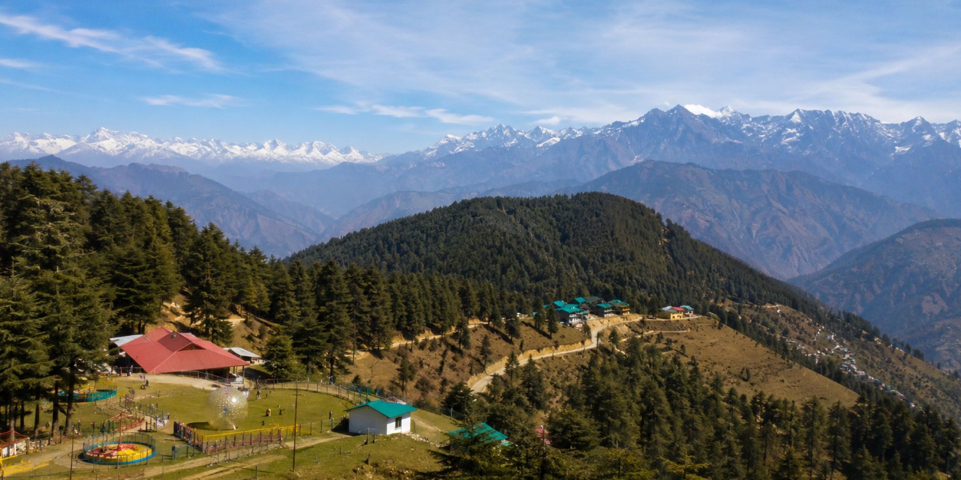 Snow-covered deodar pine forests and mountain ridges in Kufri near Shimla