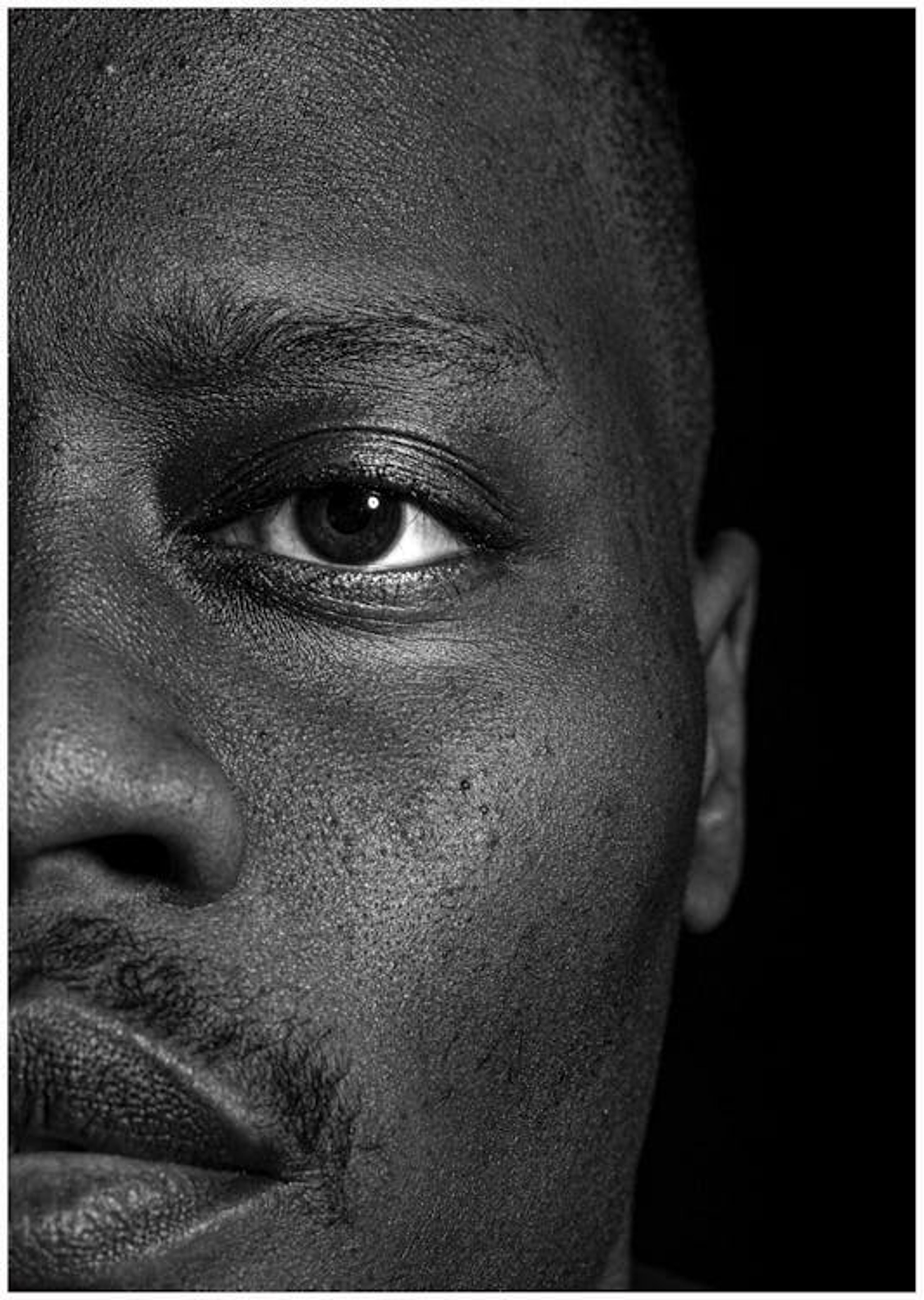 Black and white close-up portrait of Harvey Specter