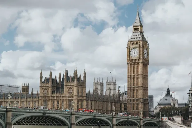 The Palace of Westminster and Elizabeth Tower beneath a cloudy sky.