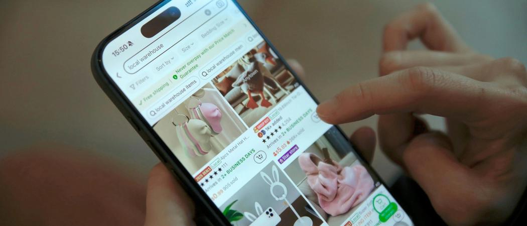 A person browsing an ecommerce product page on a mobile phone, illustrating the online buying experience