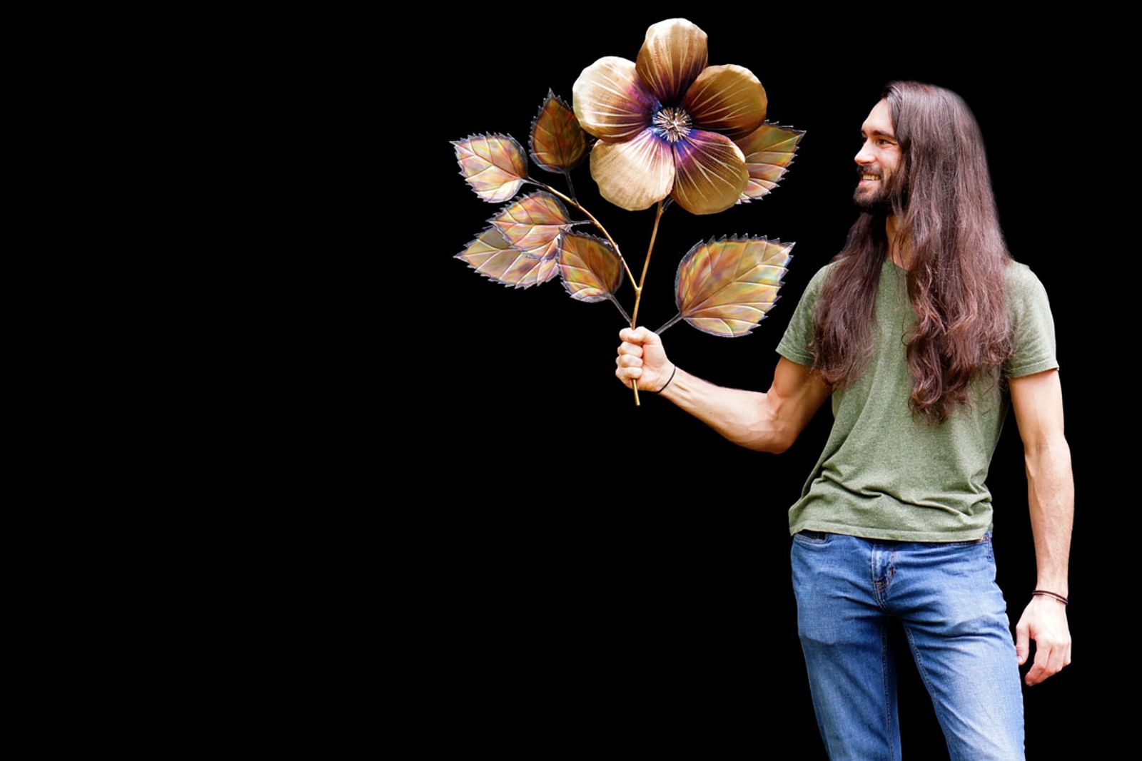Artist Aiden Dale with hibiscus sculpture
