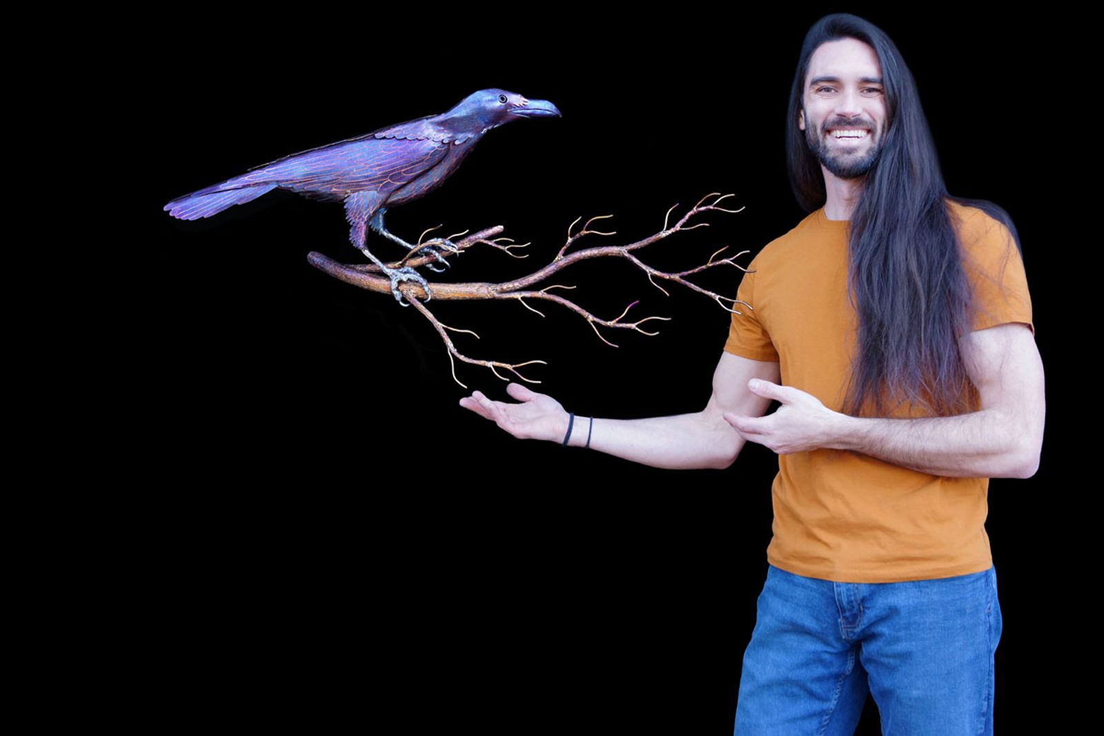 Artist Aiden Dale with his metal wall hanging crow sculpture.