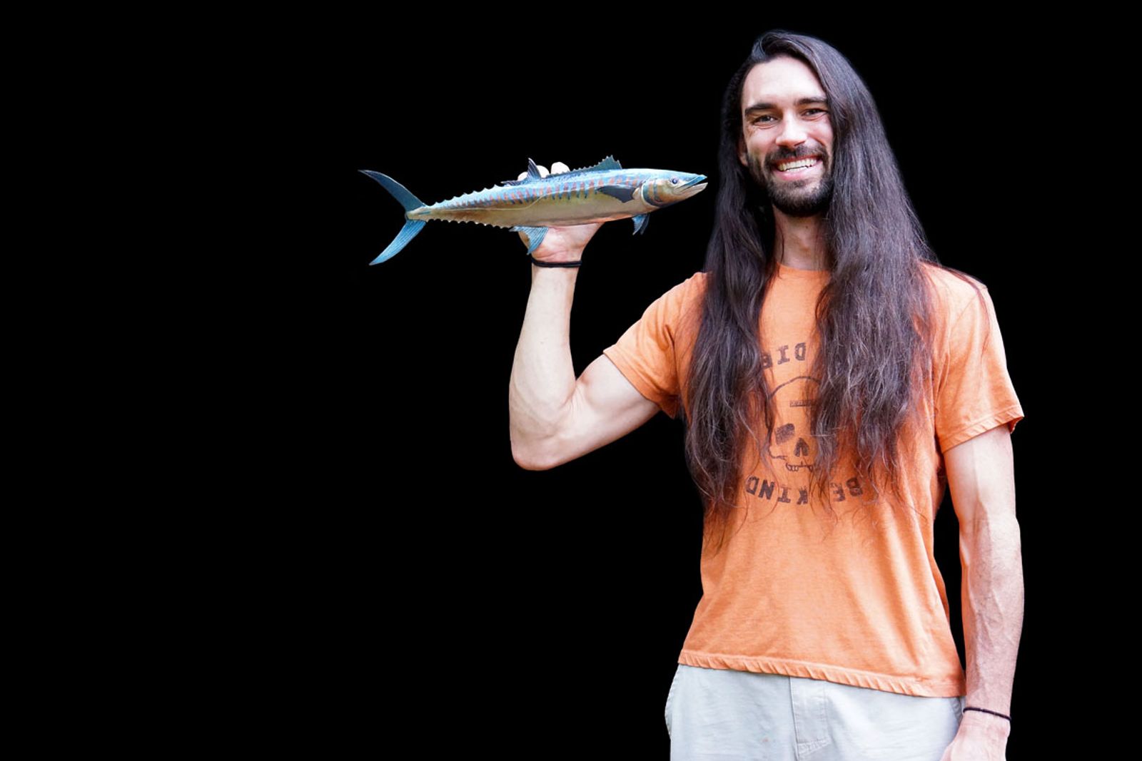Artist Aiden Dale with his stainless steel king mackerel metal sculpture