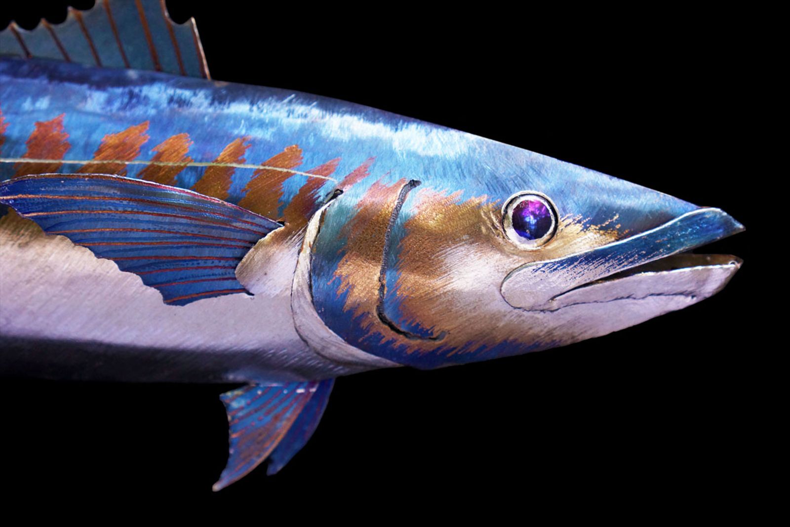 Metal king mackerel sculpture closeup of head