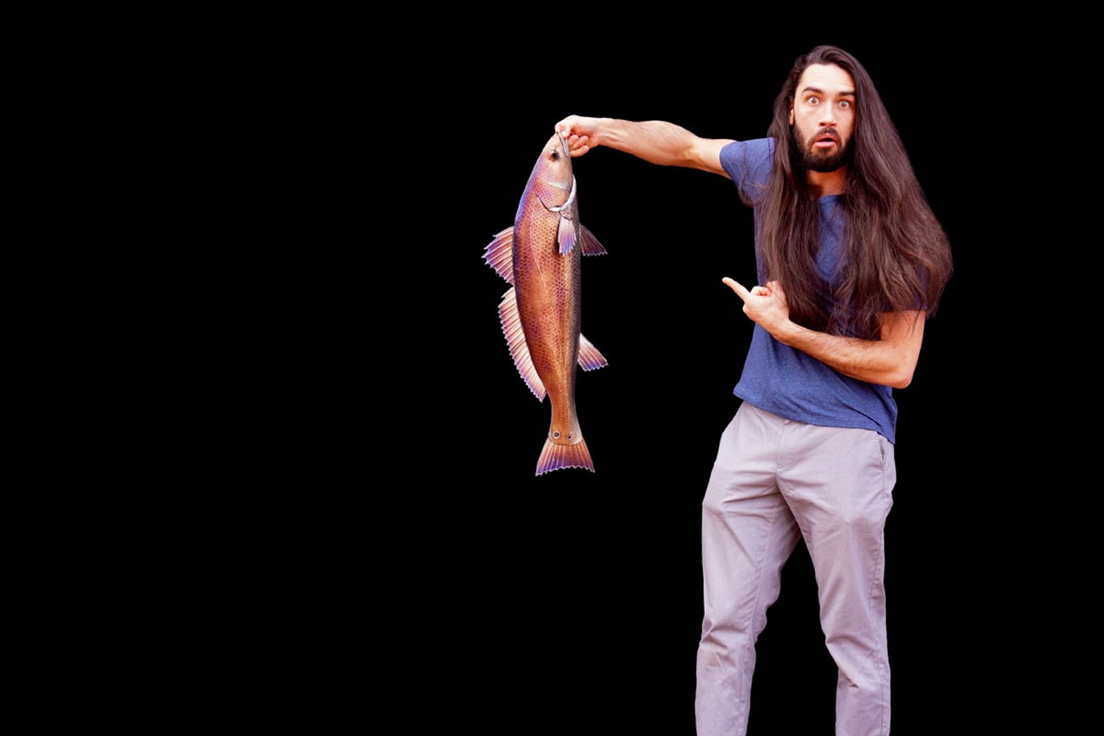 Sculptor Aiden Dale with freshly caught metal red drum sculpture