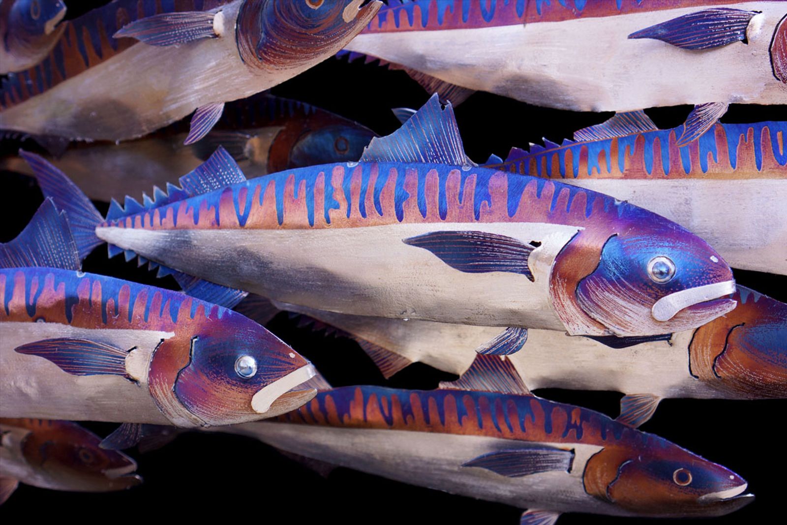 Close up of metal mackerel school sculpture