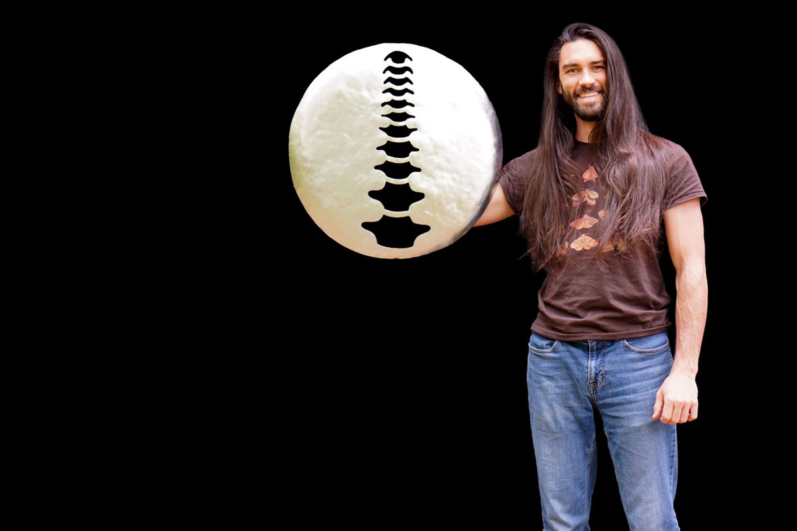 Artist Aiden Dale with Sterling Chiropractic sign.