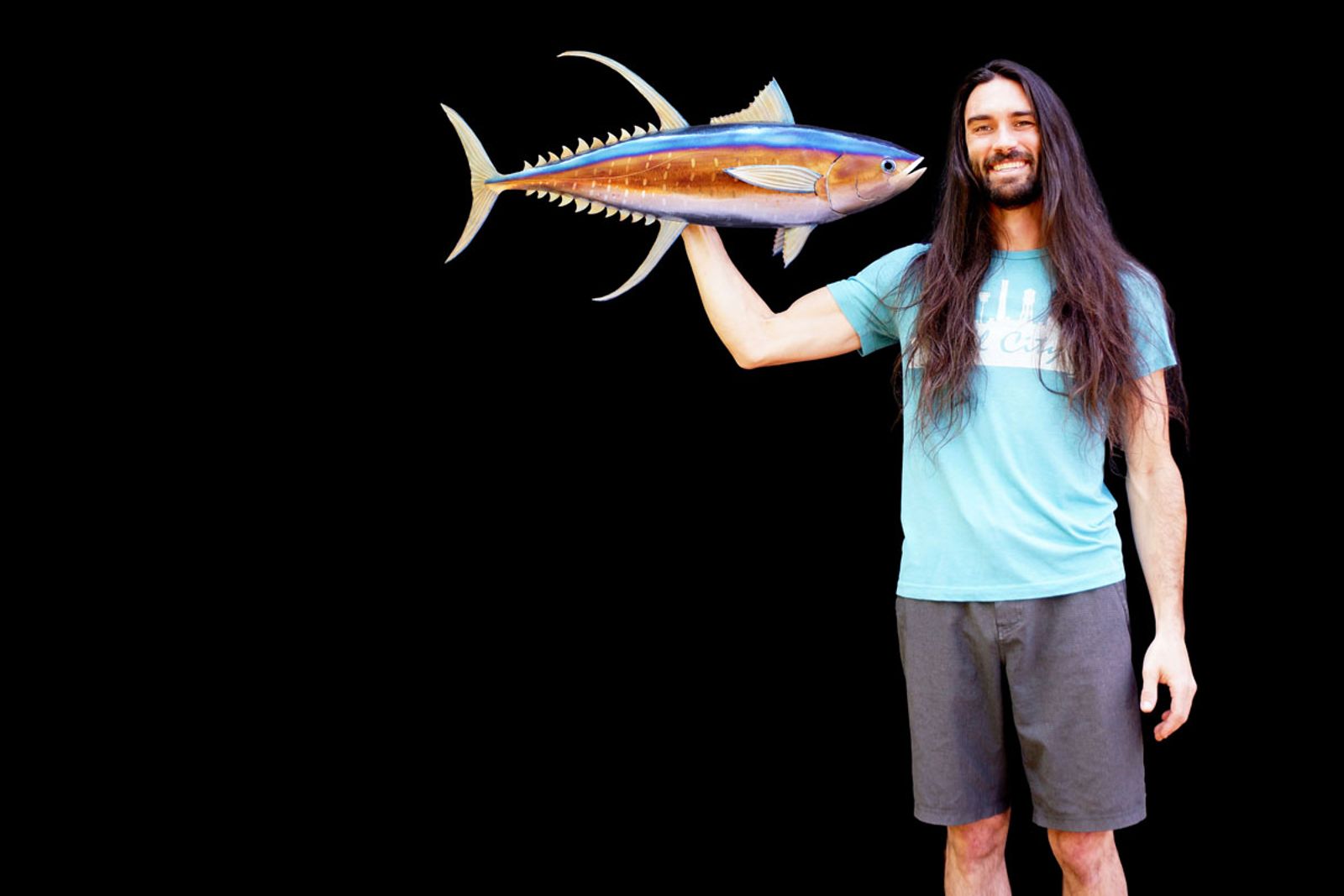 Artist Aiden Dale with his metal yellowfin tuna sculpture.
