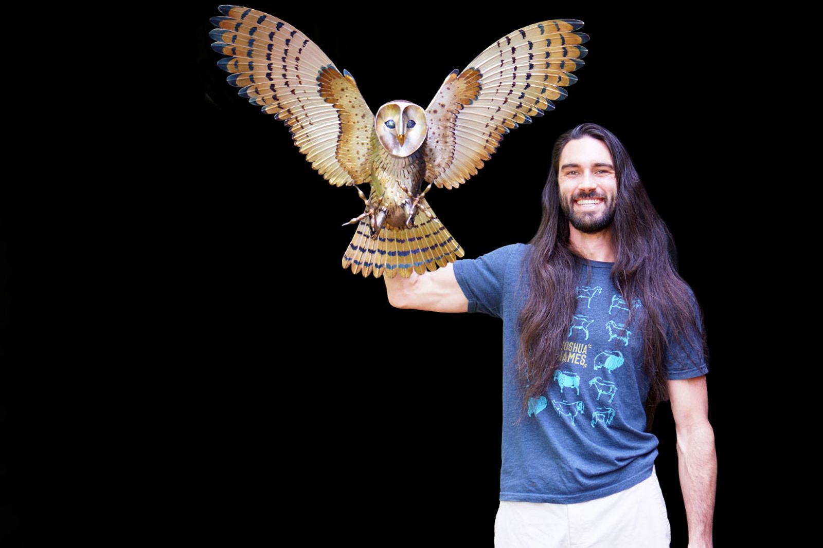 Artist Aiden Dale with his metal barn owl sculpture.
