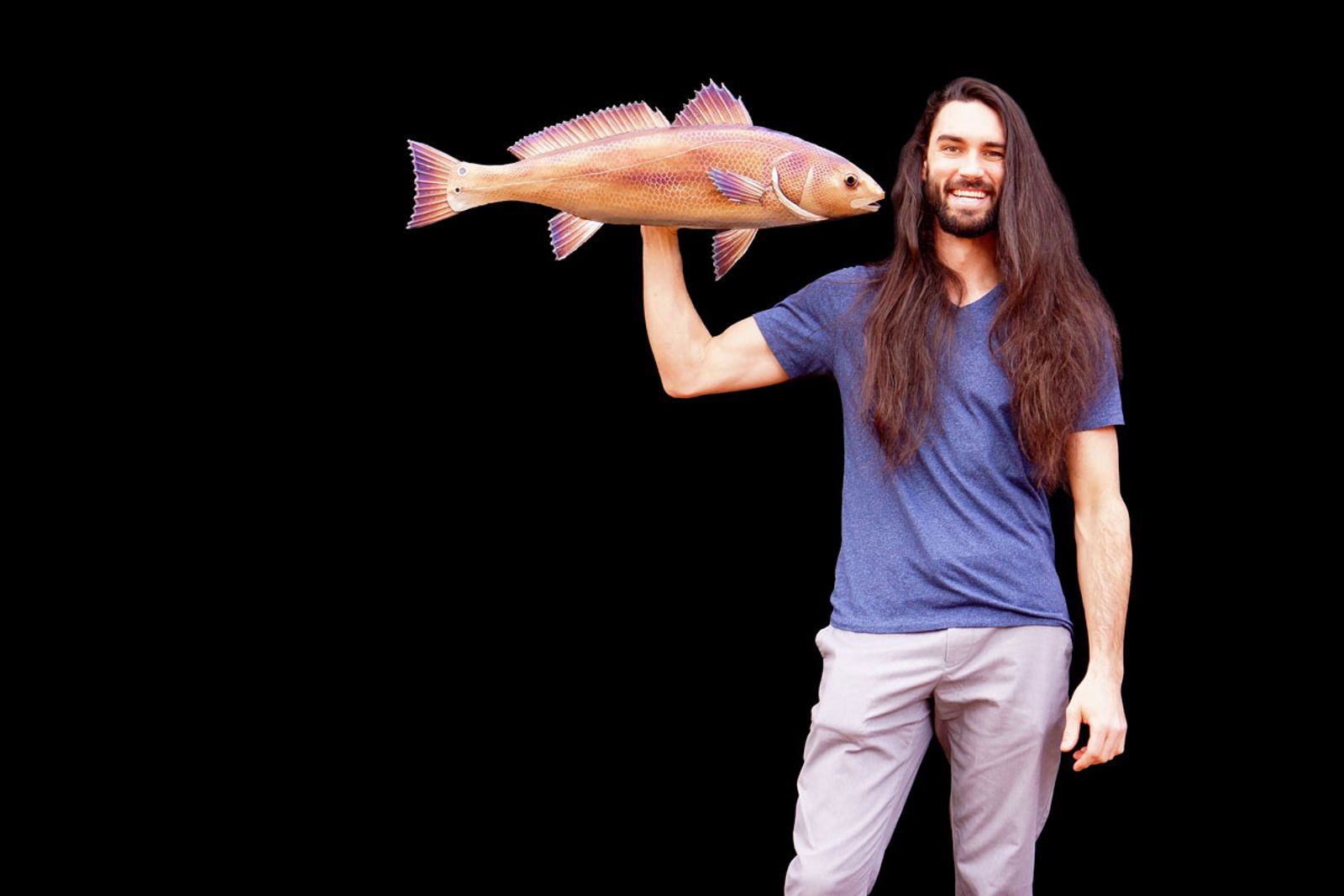 Artist Aiden Dale with stainless steel red drum sculpture