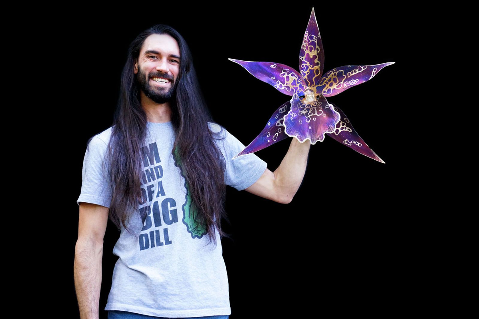 Artist Aiden Dale with his pacific matriarch or beallara Patricia McCully orchid metal sculpture.