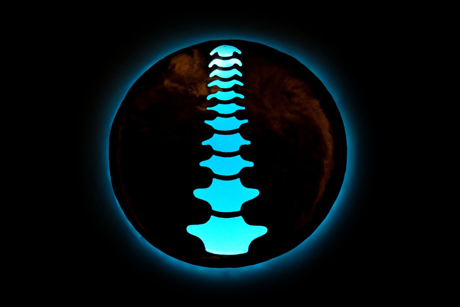 Sterling Chiropractic sign with light blue backlight.