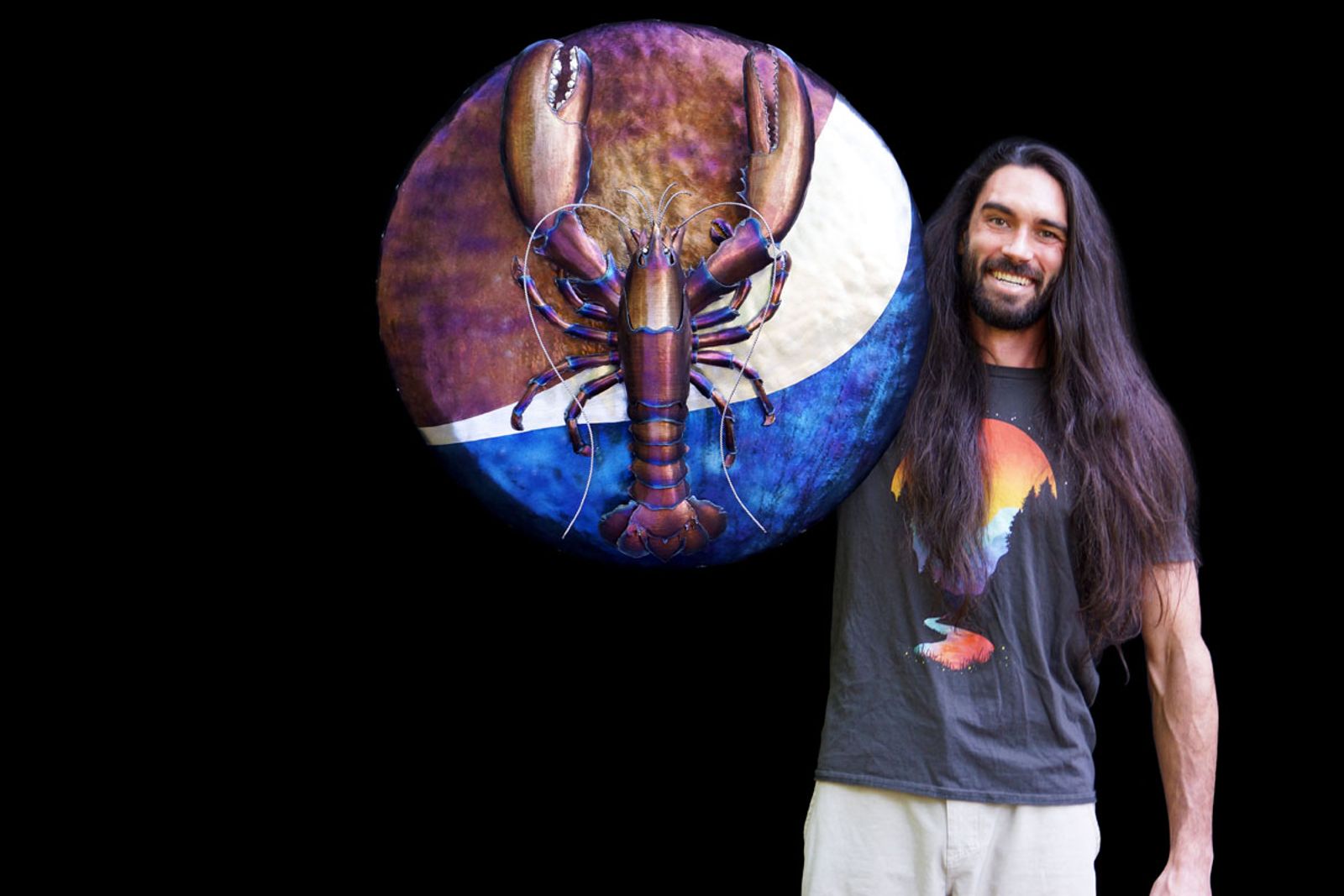 Artist Aiden Dale with his metal Pepsi Red Lobster crossover commissioned sculpture.