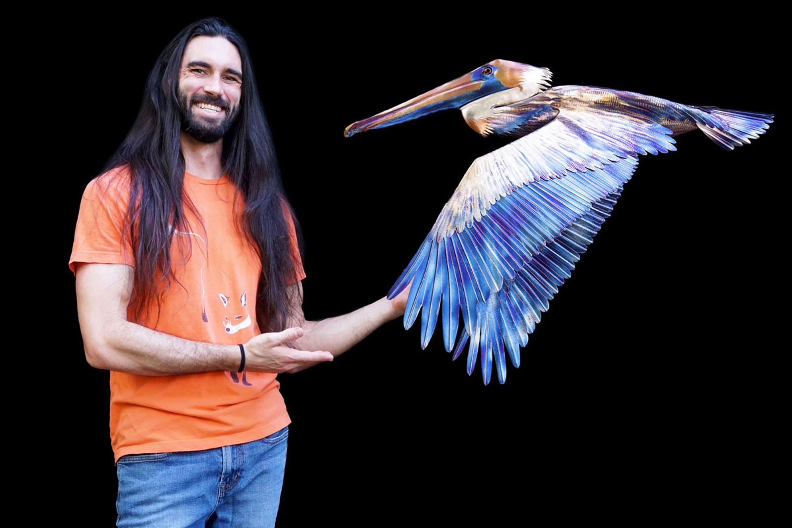 Artist Aiden Dale with his Stainless steel pelican sculpture.