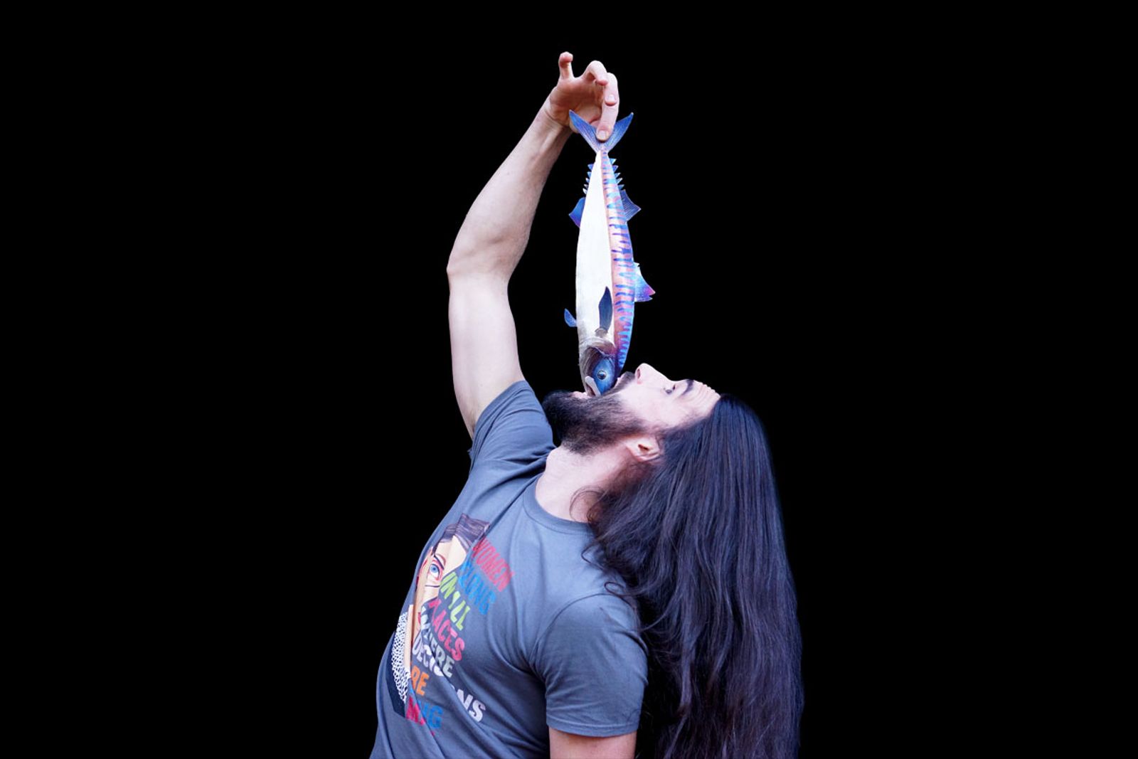 Artist Aiden Dale with metal mackerel sculpture