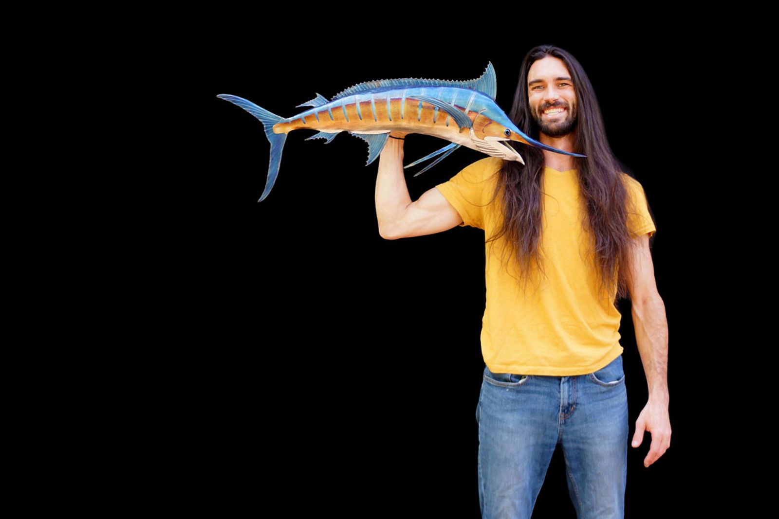 Artist Aiden Dale with his smaller blue marlin metal sculpture