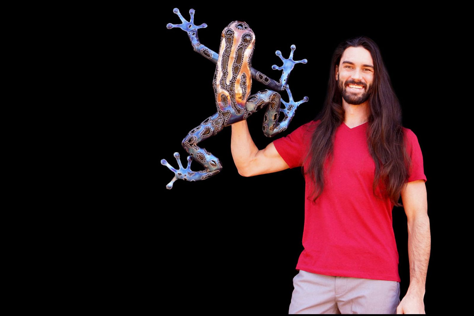 Artist Aiden Dale with metal poison dart frog sculpture!