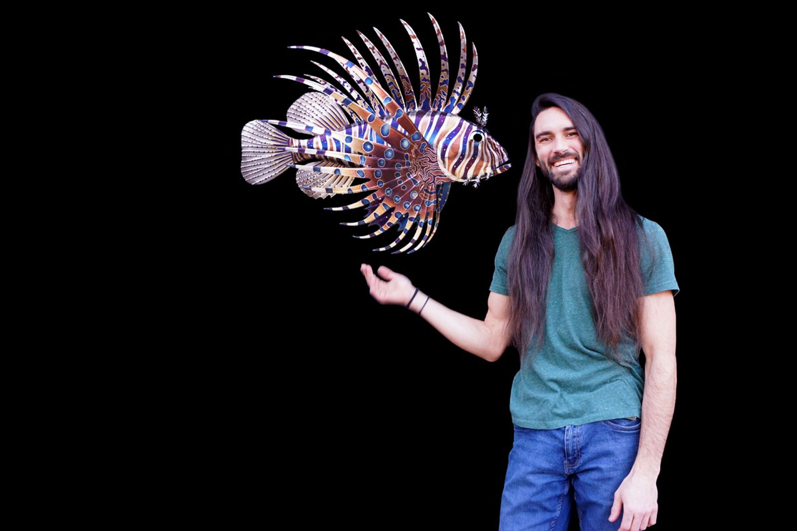 Artist Aiden Dale with his metal Lionfish sculpture.