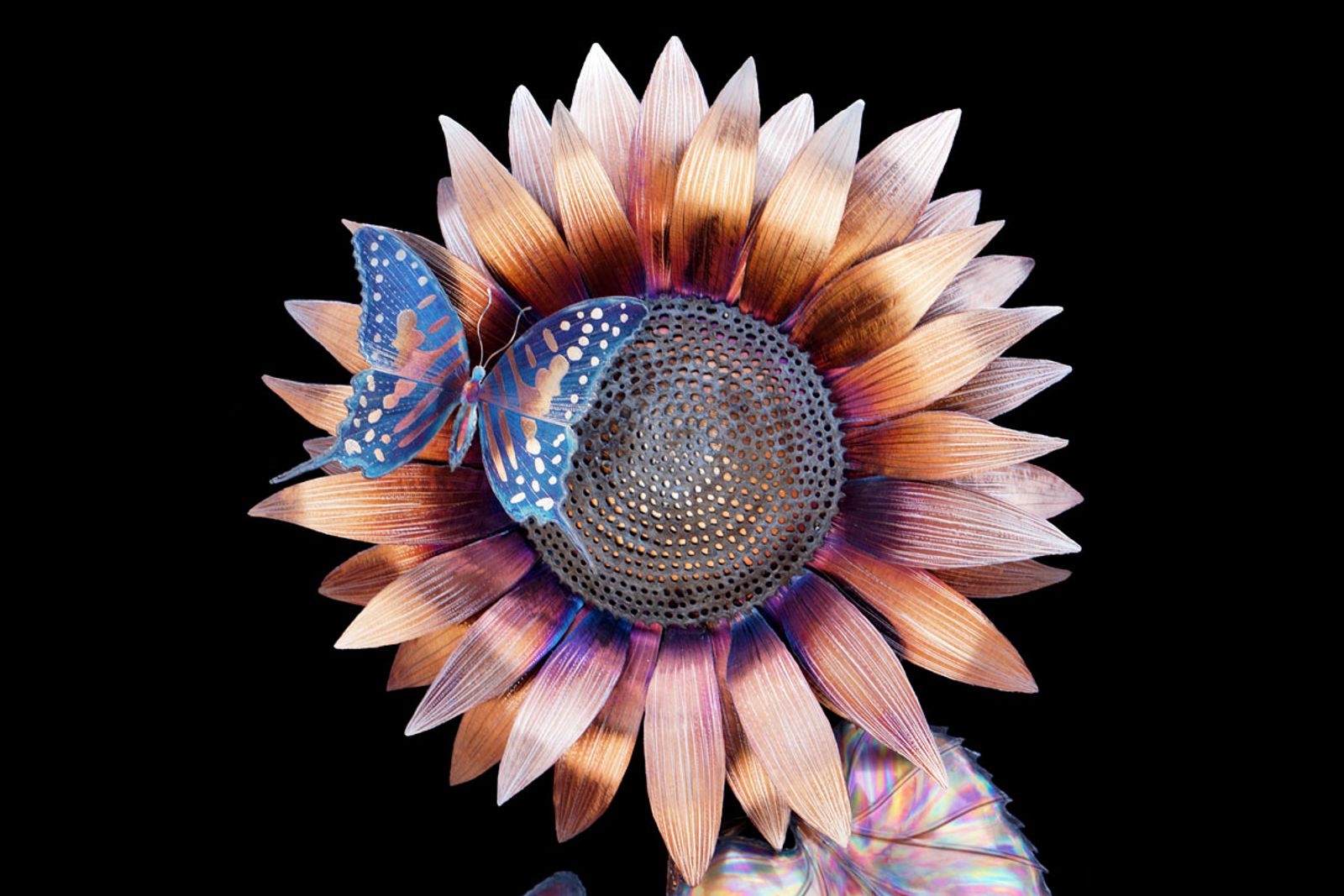 Close up of metal sunflower with butterfly sculpture