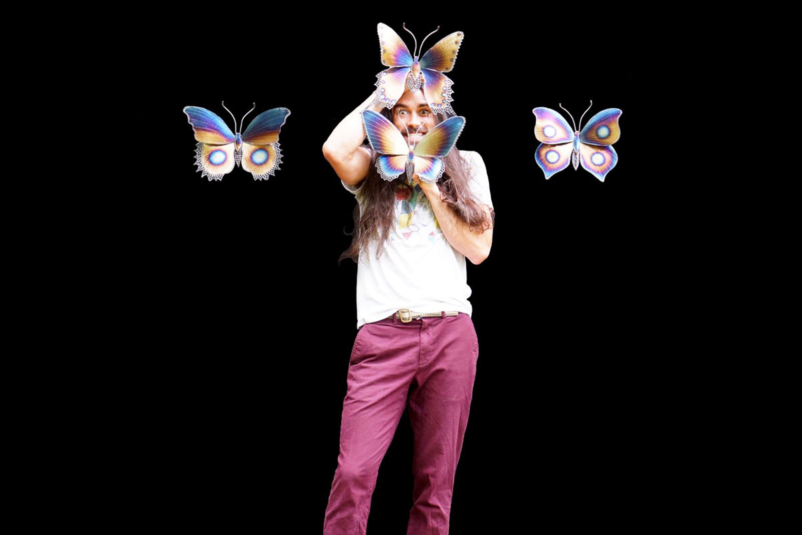 Artist Aiden Dale with some small stainless steel butterfly designs