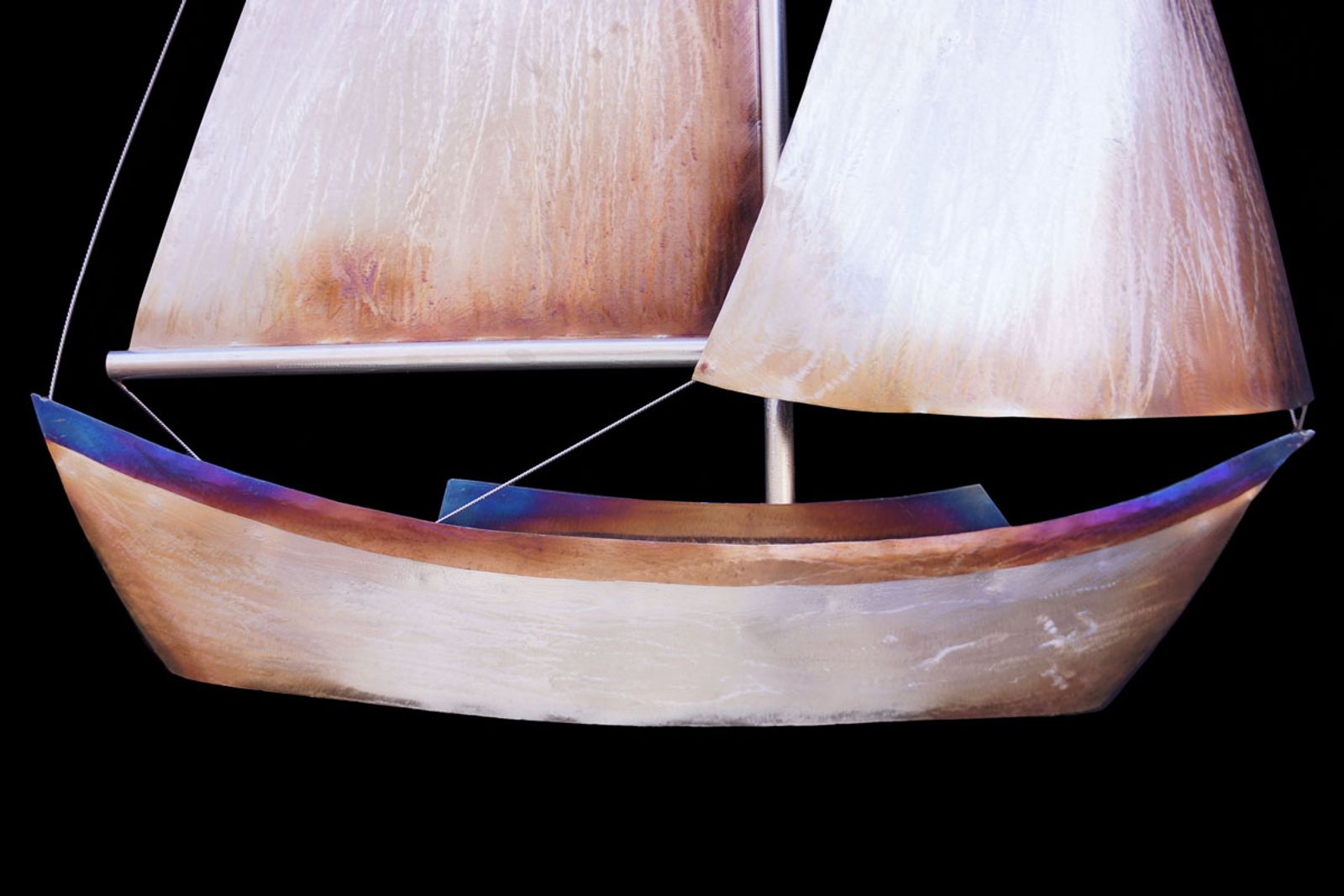 Closeup of sailboat sculpture hull.